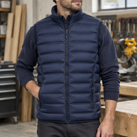 Model wearing the navy Pinnacle body warmer