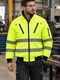 Worker wearing the lime jacket in a workshop