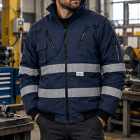 Worker wearing the navy jacket in a workshop