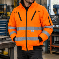 Worker wearing the orange jacket in a workshop
